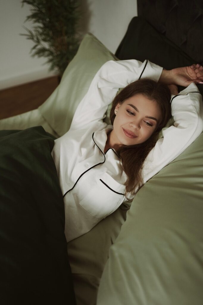 bed, bedroom, sleep, sheet, cozy, room, blanket, mattress, home, rest, bedding, hotel, breakfast, woman, candle, comfort, pillows, house, book, light, sleeping