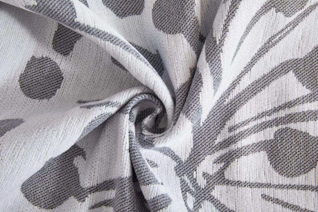 Close-up of a textured grey and white patterned fabric, ideal for home decor inspiration.