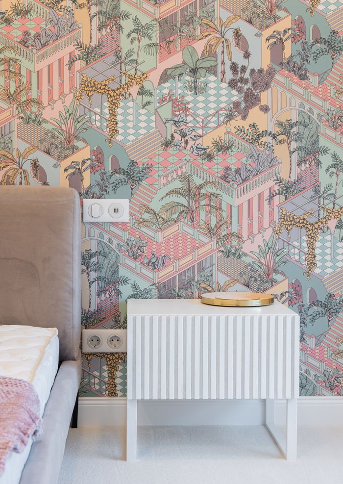🧱 Premium Wallpapers White minimalist nightstand and comfy bed with soft headboard placed near wall with creative ornamental walls in modern apartment